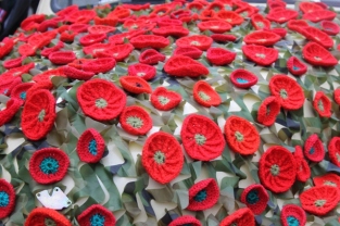 Photo No. 5 of 12 - Anzac Day March at Federation Square, Melbourne, Australia featuring Australia’s first own car – its hood here blanketed with a sheath of poppies photo taken by Karen Robinson 25.4.2015.JPG