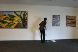 No. 24 - 'When words are hard to find' Solo Exhibition of Karen Robinson 6.5.15 Curator Tobias putting up wording at Gee Lee-Wik Doleen Gallery for Exhibition.JPG