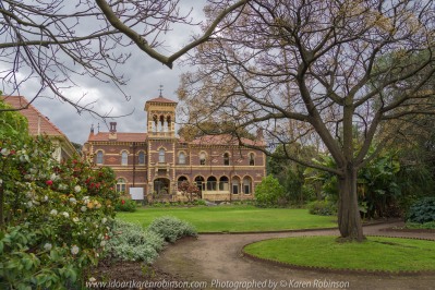 Elsternwick, Victoria - Australia_Photographed by ©Karen Robinson_ www.idoartkarenrobinson.com September 10, 2017 Comments: My hubby and I with the Craigieburn Camera Club at Rippon Lea House and Gardens. "It is one of Australia's finest grand suburban estates and the first to achieve National Heritage Listing, recognising its unique significance. The historic mansion is located within a vast pleasure garden of sweeping lawns that cover more than 14 acres and features a windmill, lookout tower, heritage orchard, lake, waterfall, fernery and more!" Photograph featuring backside of Mansion with a circular drive way in foreground.